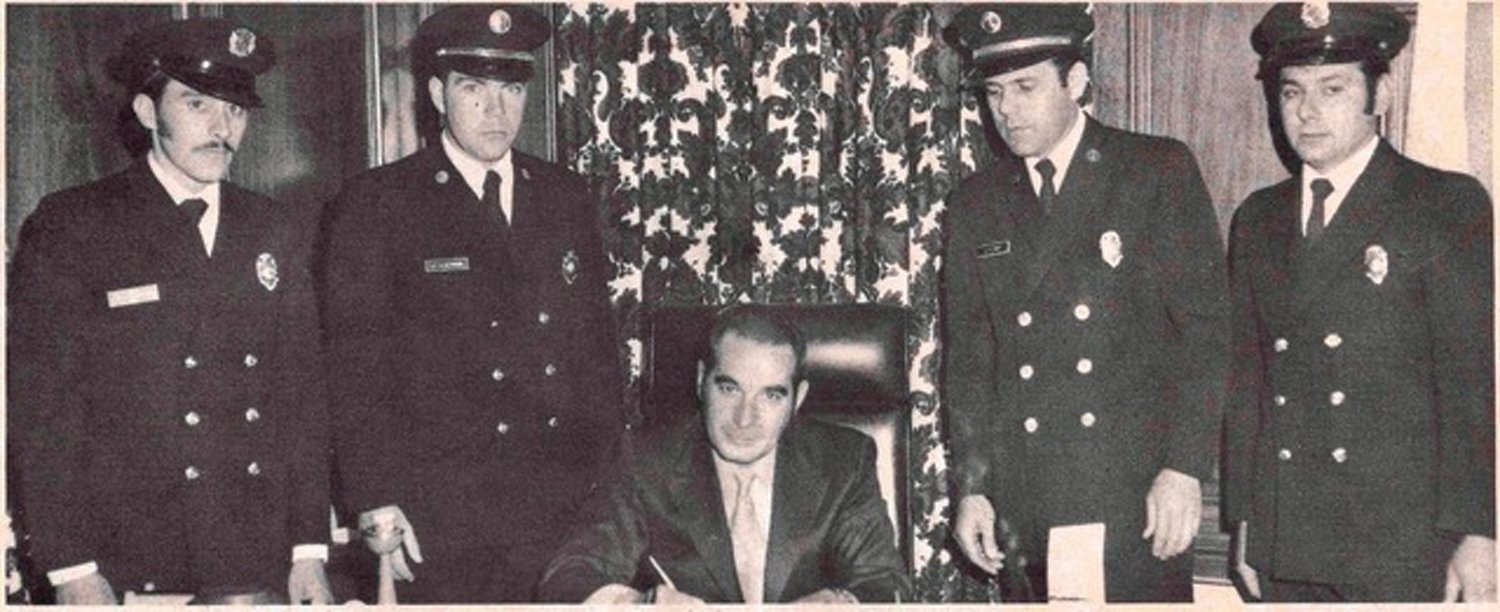 FOUNDING FATHERS: Signing Local 1950’s fist Collective Bargaining Agreement with the Town of Johnston were, from left, Secretary-Treasurer William Almeida, Vice President Stanley Heywood, Town Administrator and later Mayor Ralph aRusso, President Clayton Quick and Richard DiBenedeto.